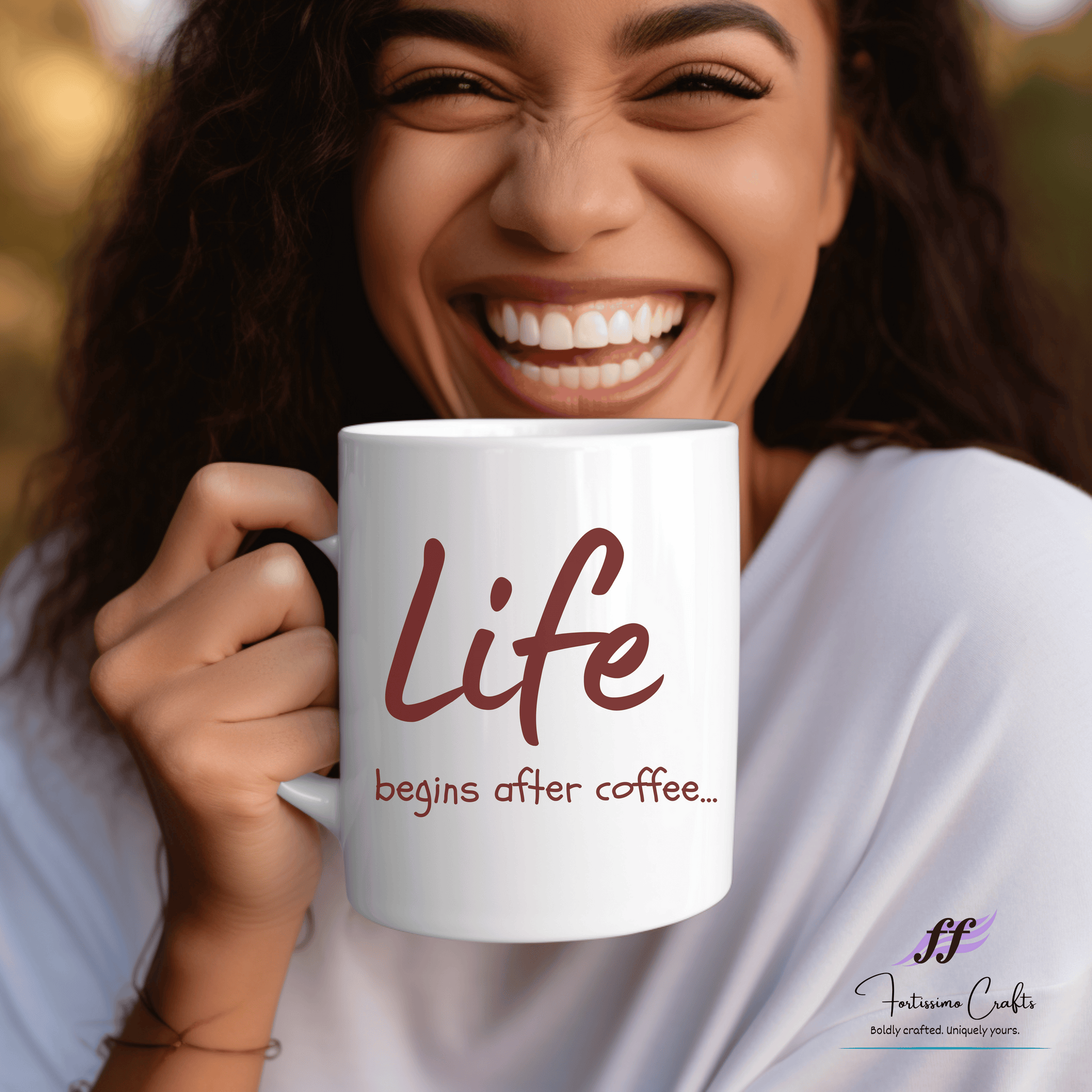 Woman holding white ceramic mug with "Life begins after coffee..." in brown letters on the front
