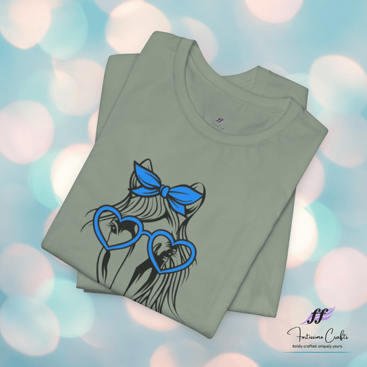 Folded green t-shirt with graphic design on a colorful blurred background