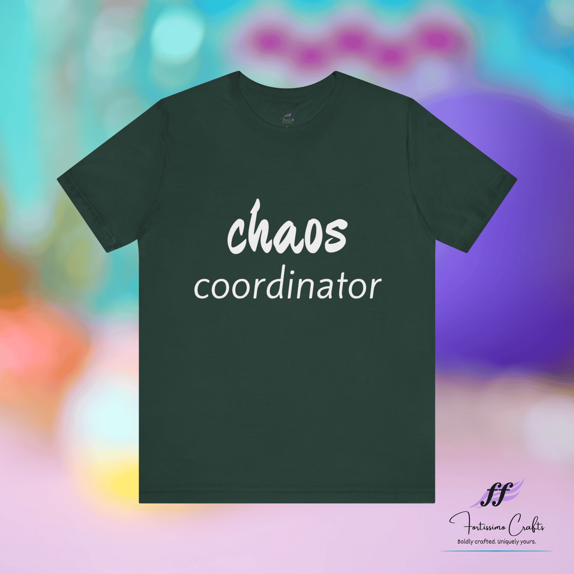 Dark green t-shirt with 'chaos coordinator' text on a colorful blurred background