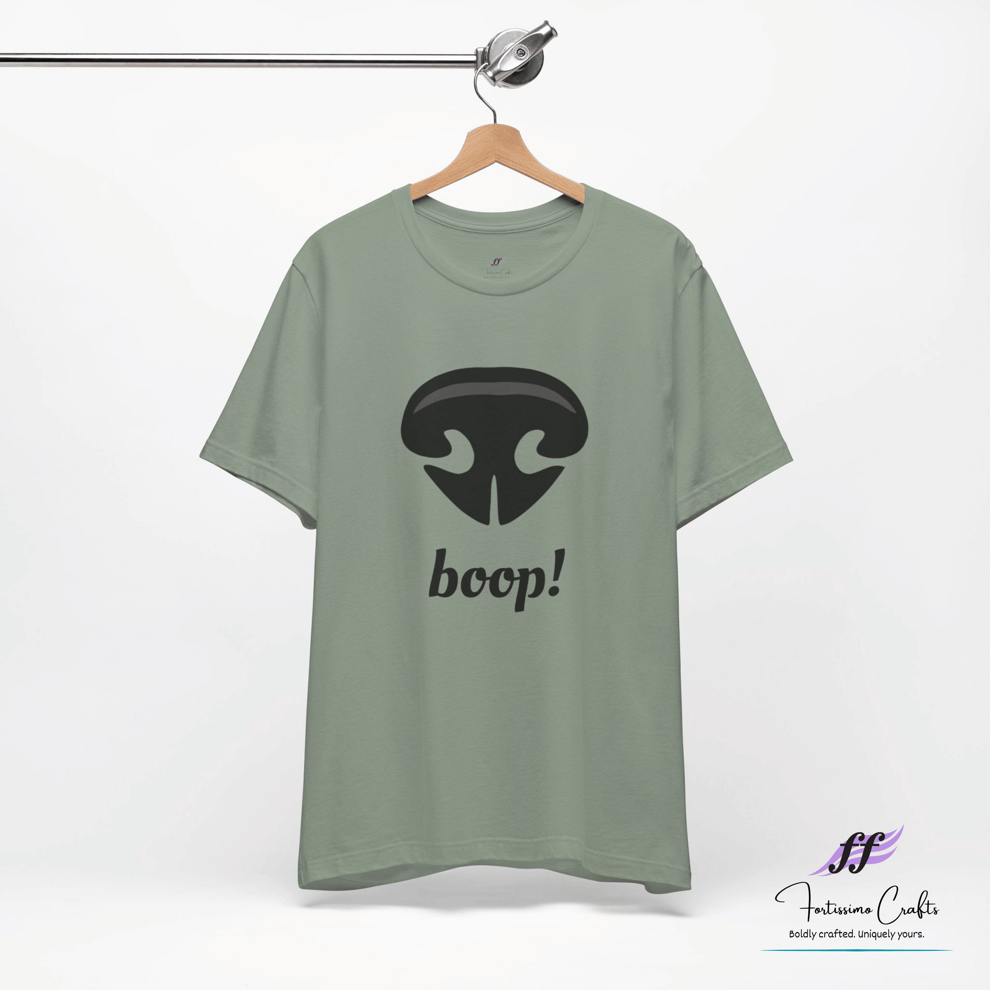 Green t-shirt with a black dog nose and 'boop!' text on a hanger against a white background.