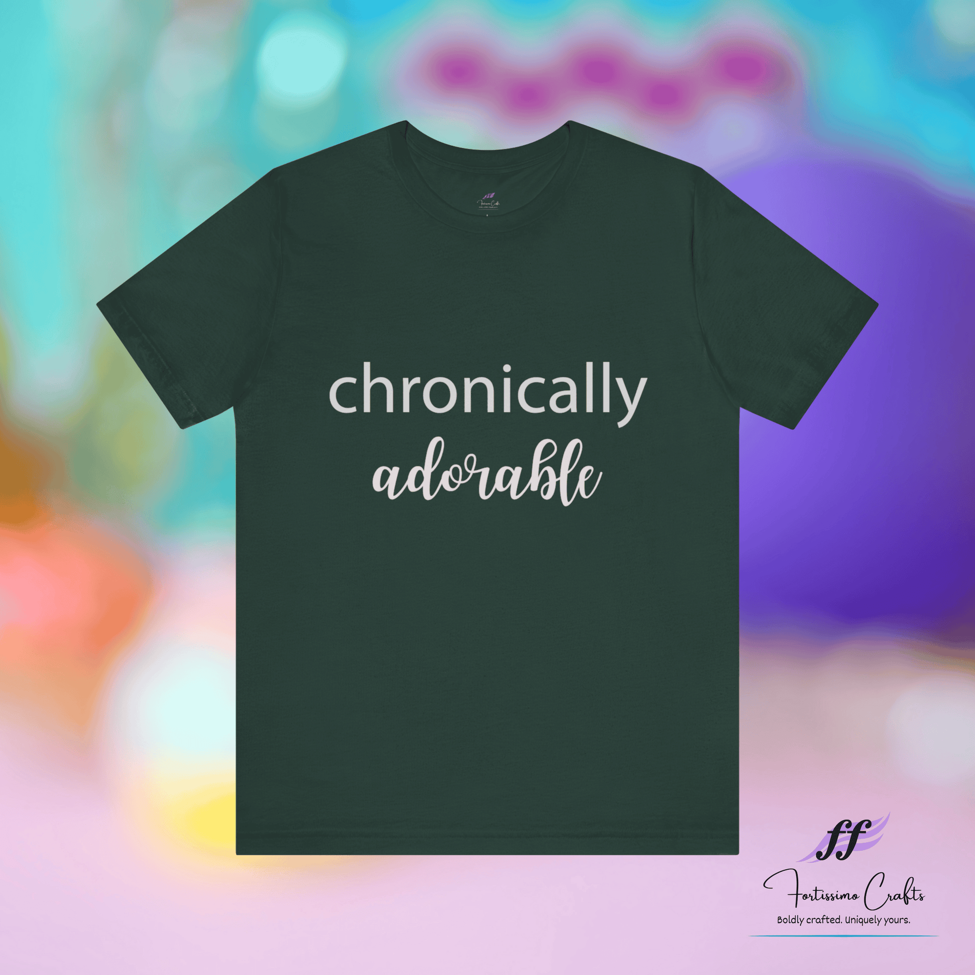 Dark green t-shirt with 'chronically adorable' text on a colorful blurred background