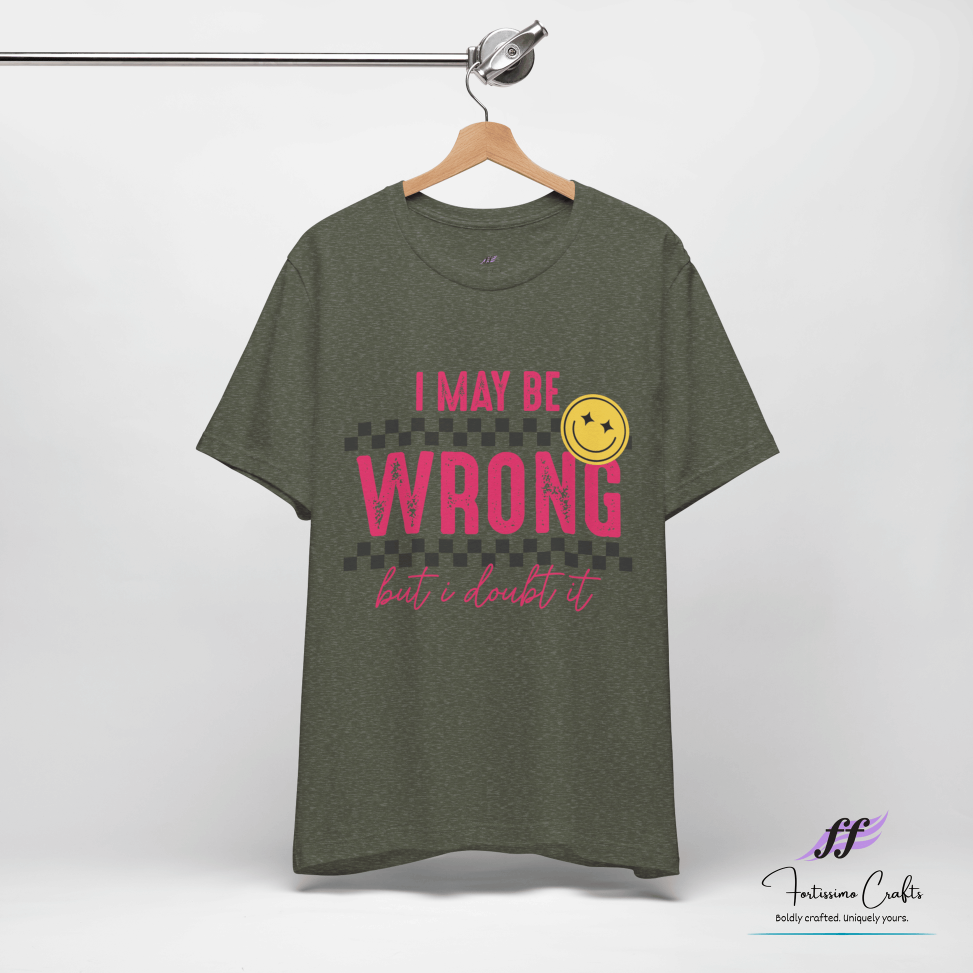 Green t-shirt with 'I May Be Wrong but I Doubt It' text and smiley face on a hanger against a white background.