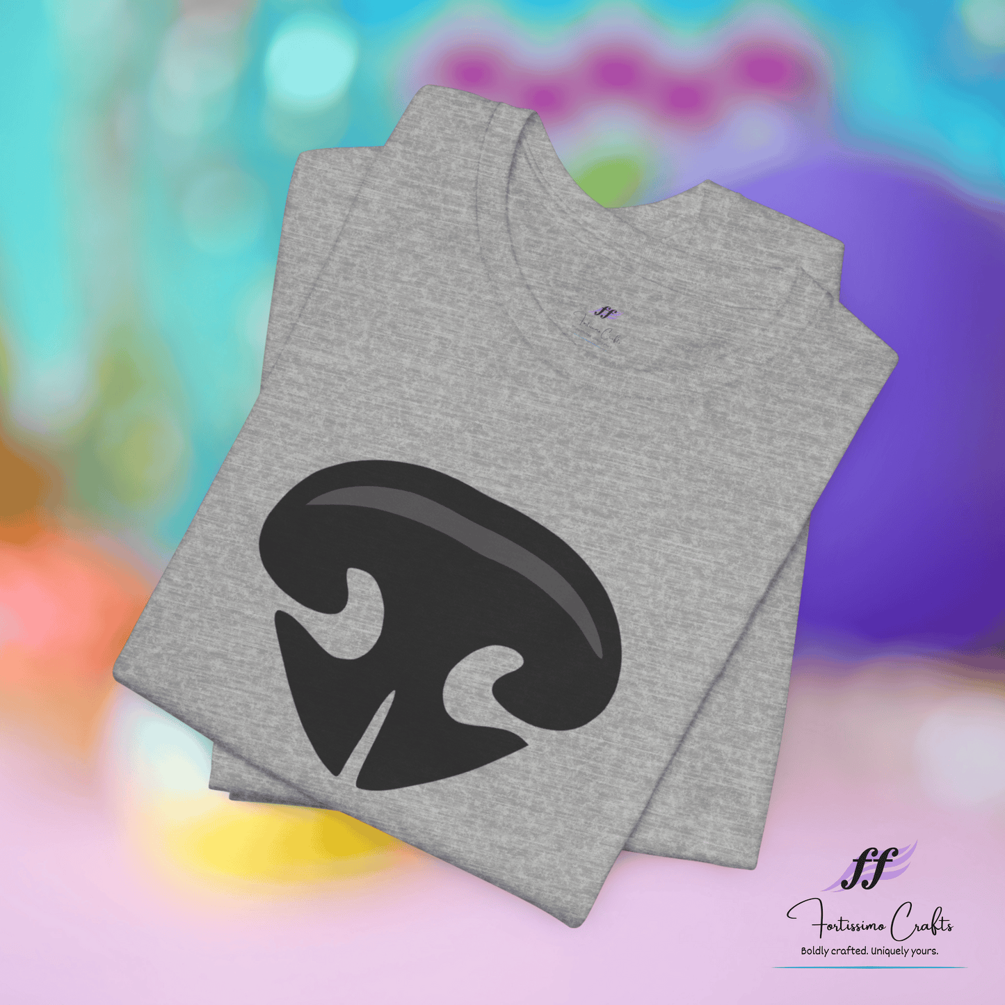 Gray t-shirt with black logo on a colorful blurred background