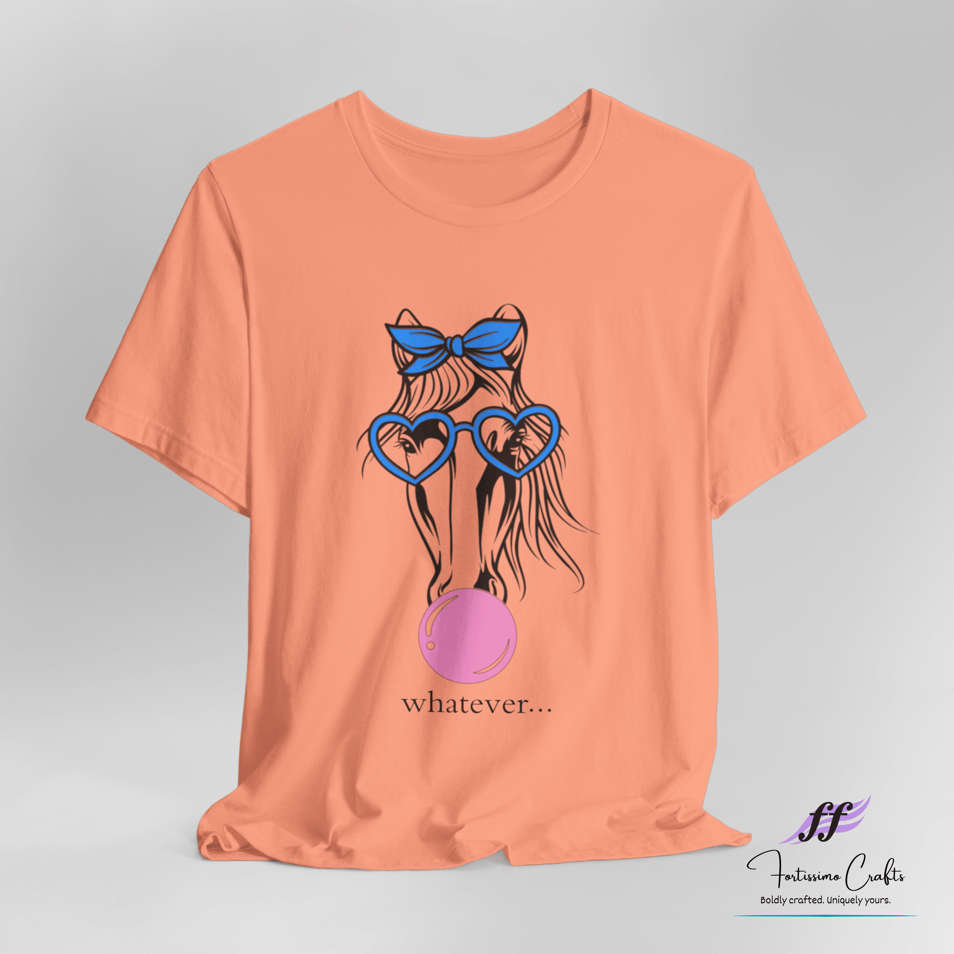 Peach t-shirt with a graphic of a horse wearing glasses and a bow, with the text 'whatever...' on a gray background.