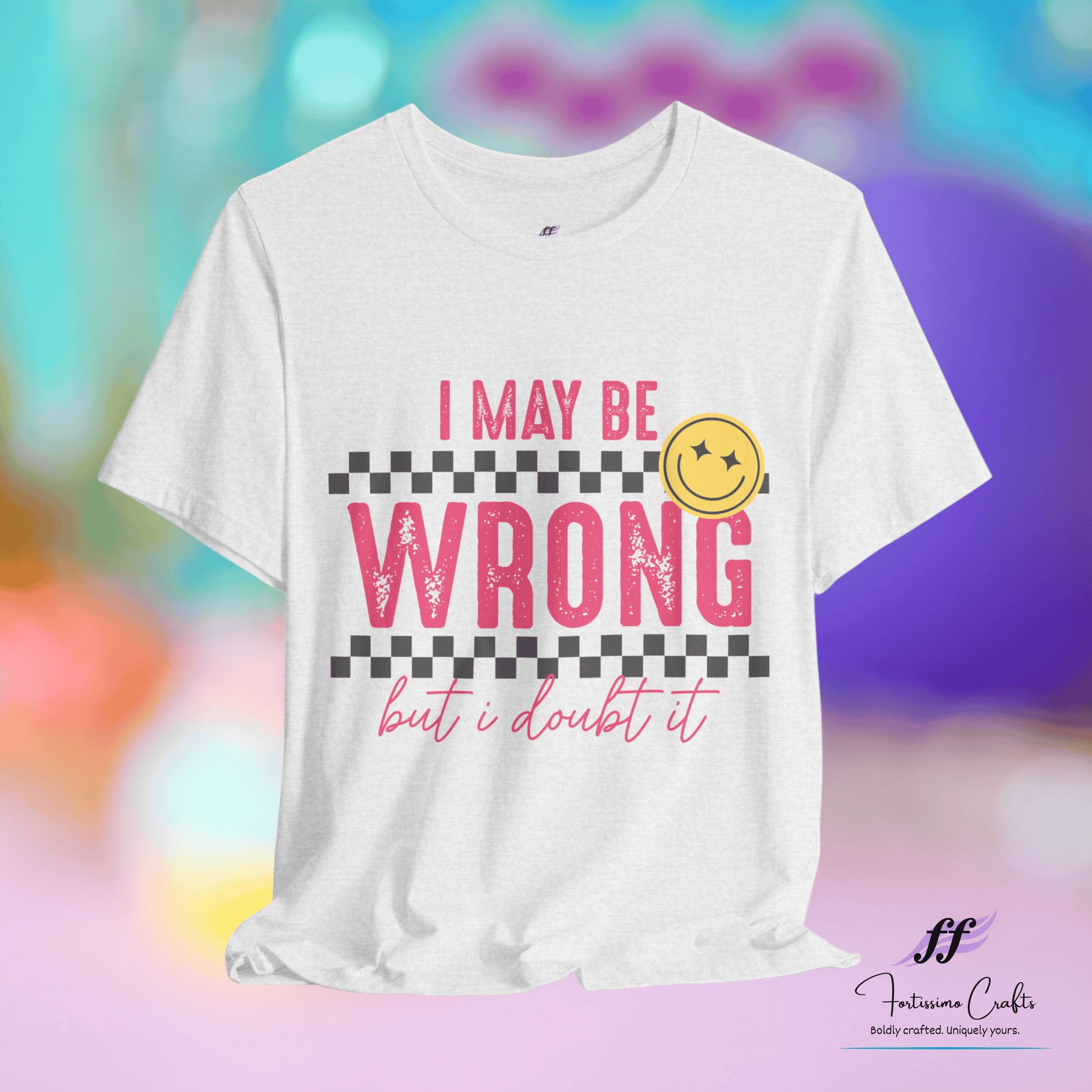 White t-shirt with pink text 'I May Be Wrong but I Doubt It' on a colorful background