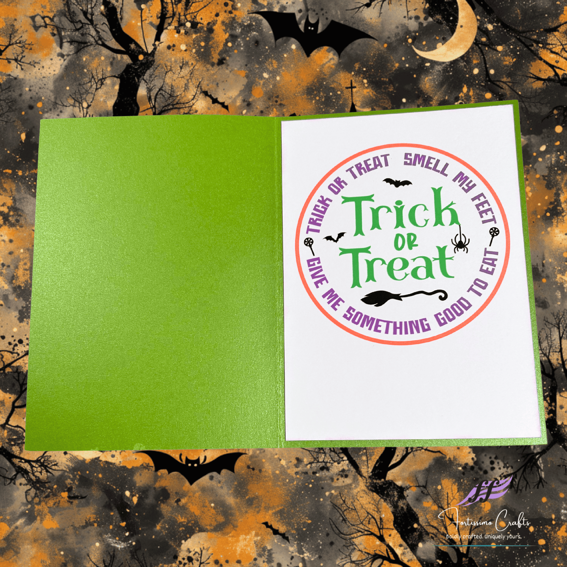 Halloween-themed card with 'Trick or Treat' text on a colorful background