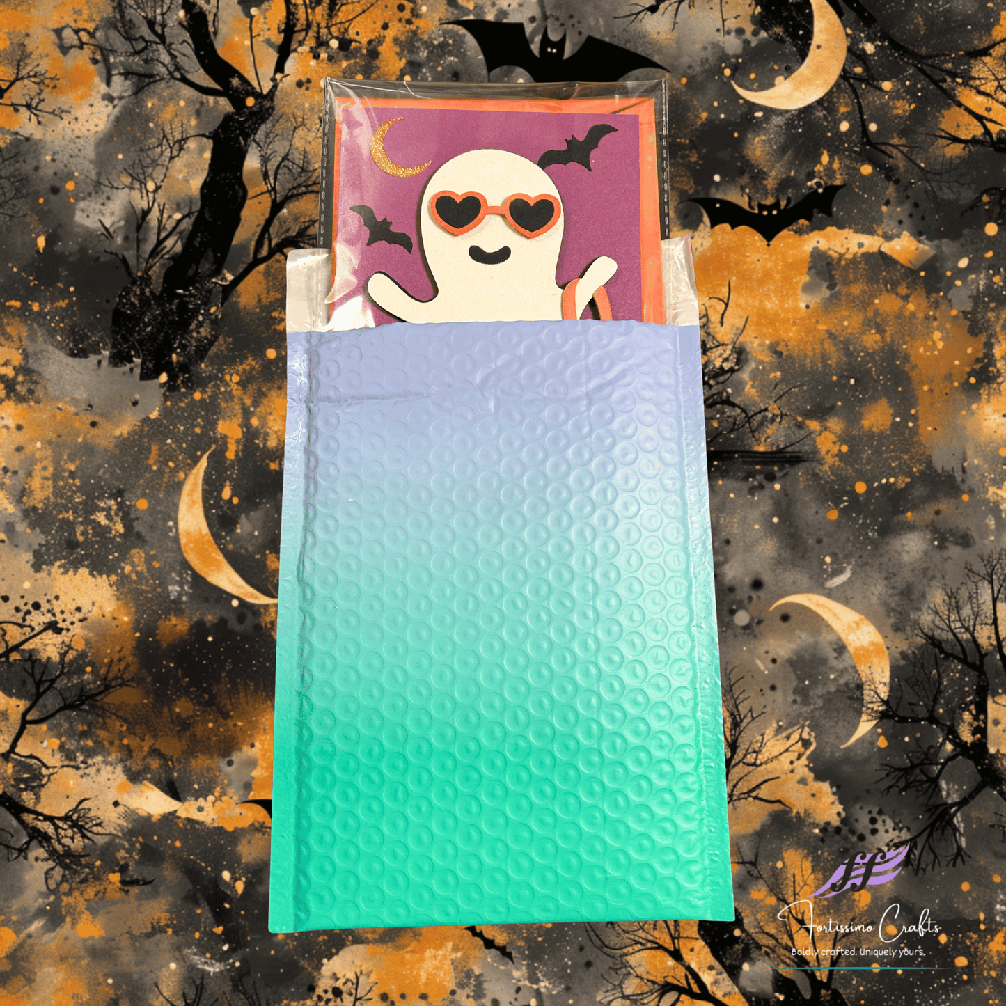 Halloween-themed bubble mailer with ghost design on a spooky background