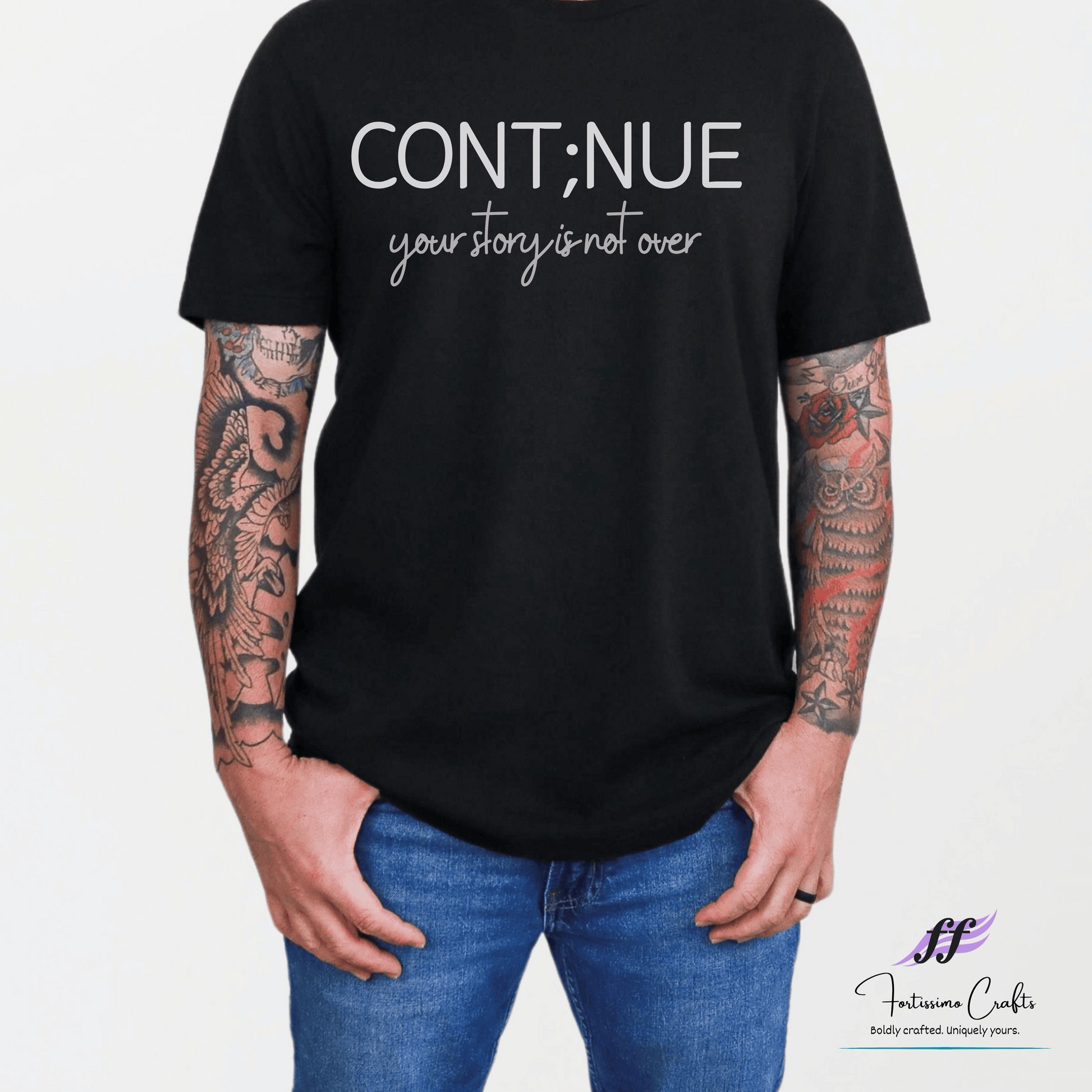 Person wearing a black t-shirt with 'CONT;NUE your story is not over' text on a white background