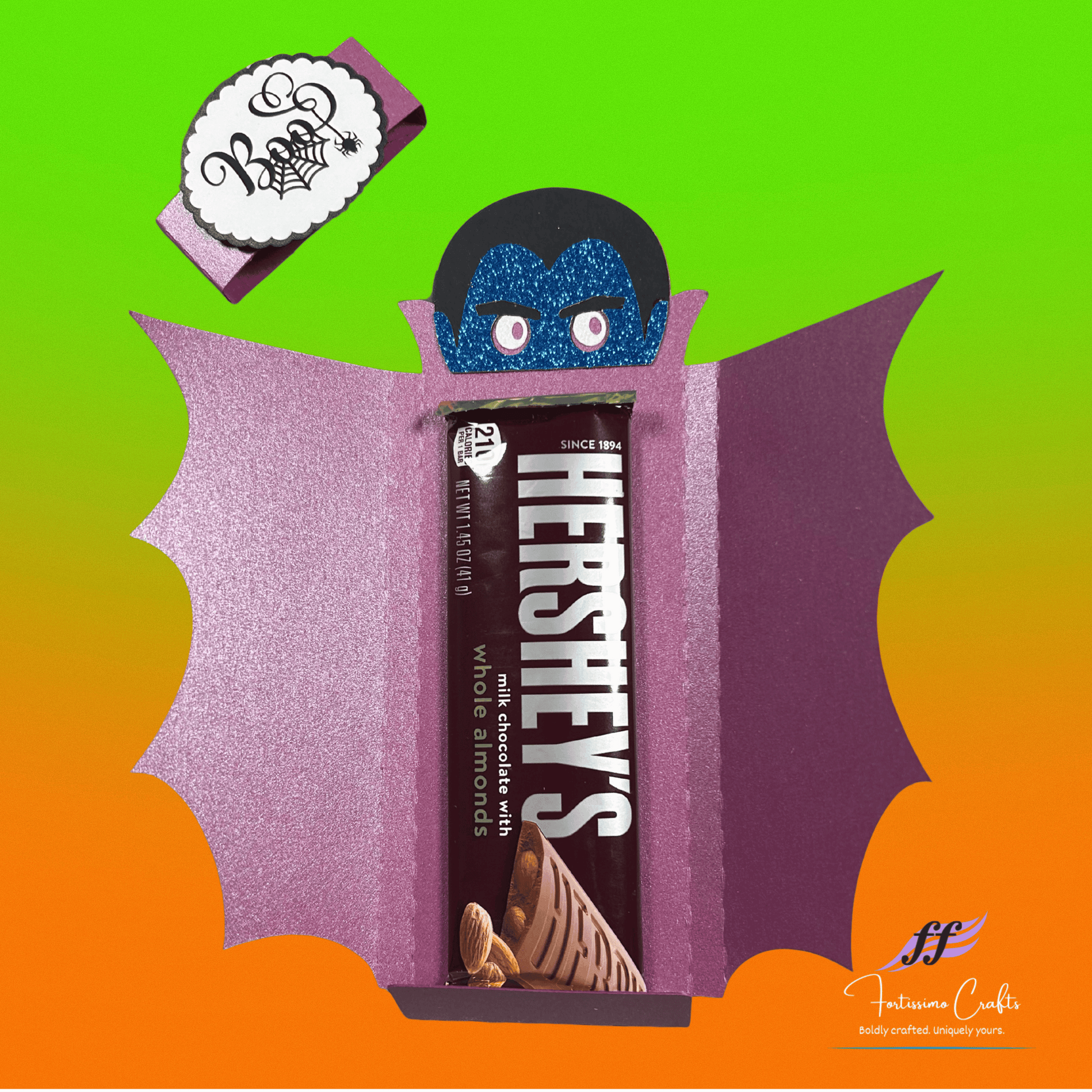 Halloween-themed vampire candy bar wrapper with purple and black design inside view with candy bar on a gradient background