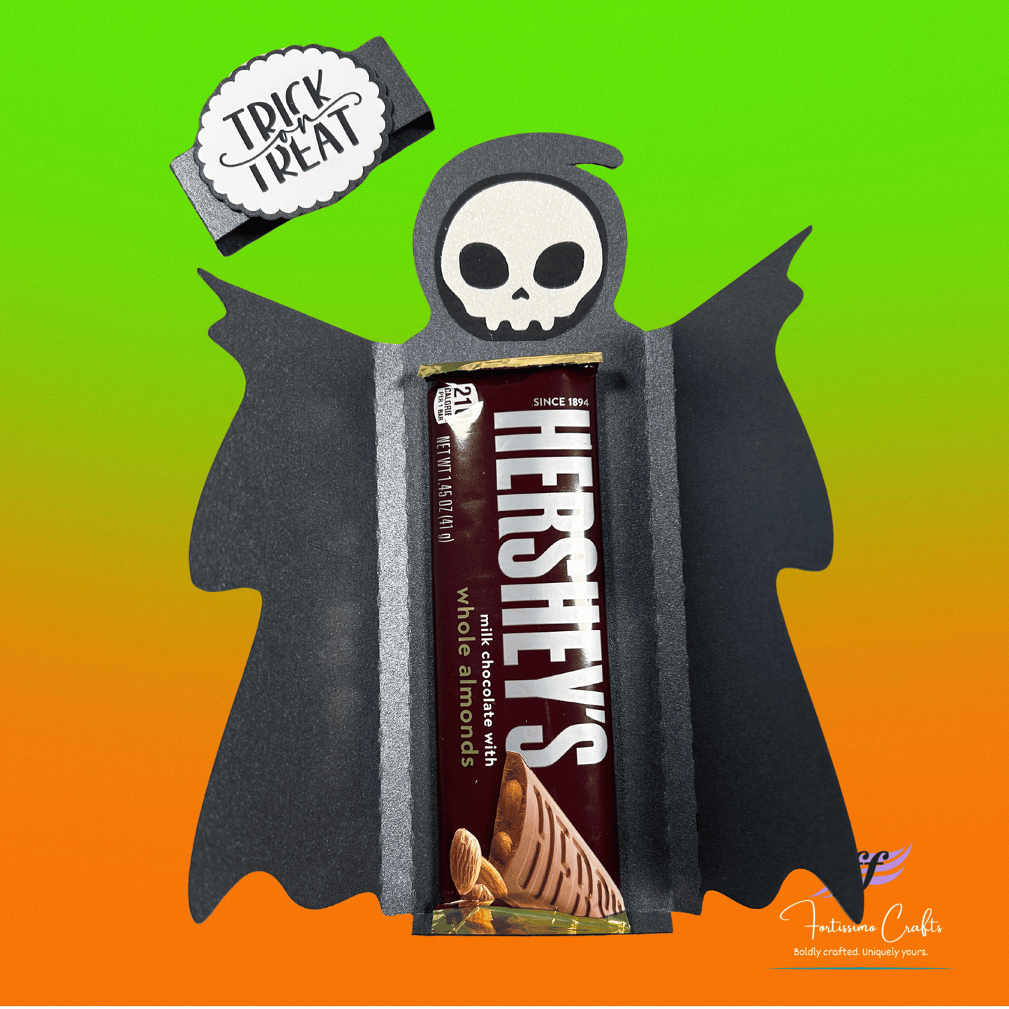Halloween-themed ghoul candy bar wrapper with black and gray design inside view with candy bar on a gradient background