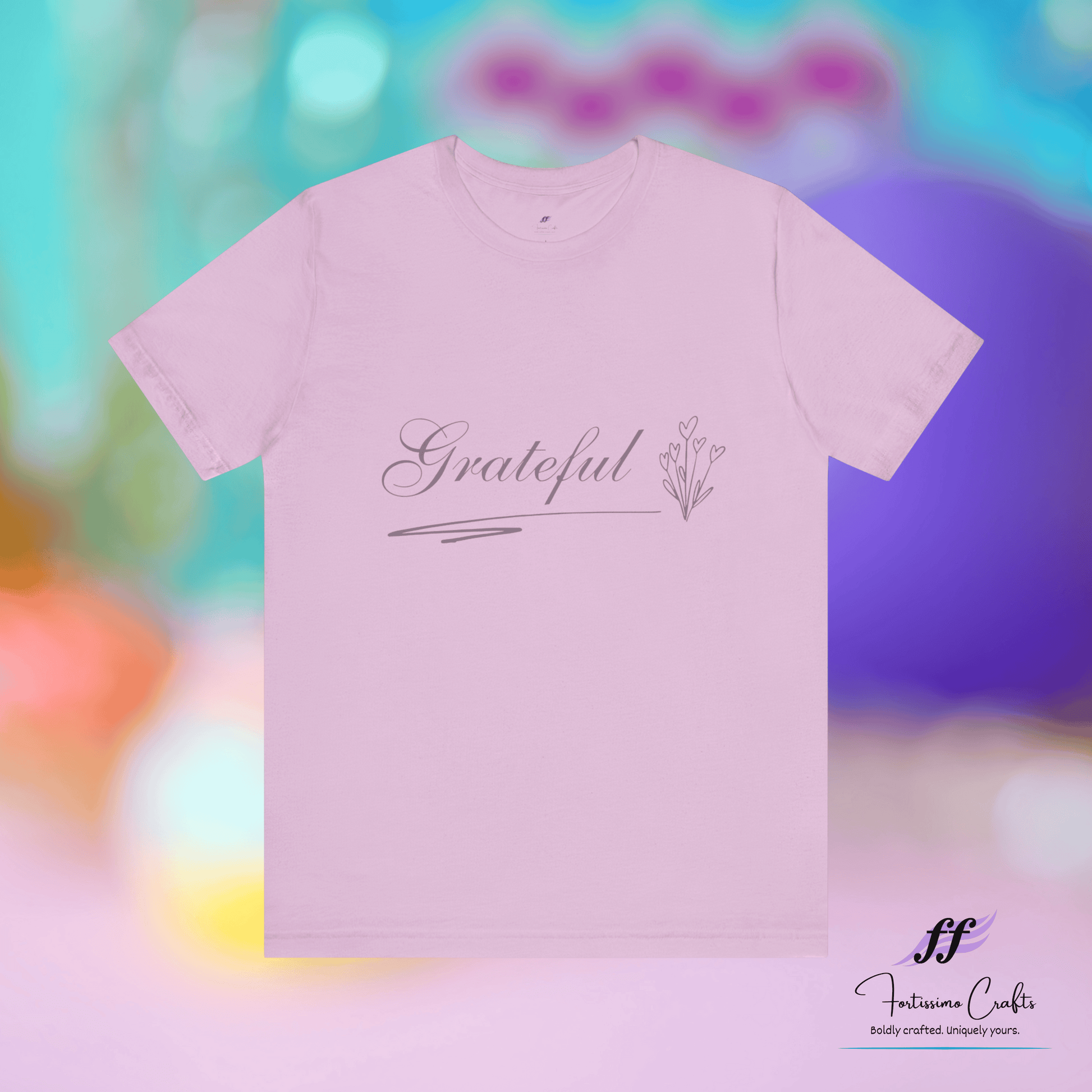 Lilac t-shirt with 'Grateful' text on a colorful blurred background