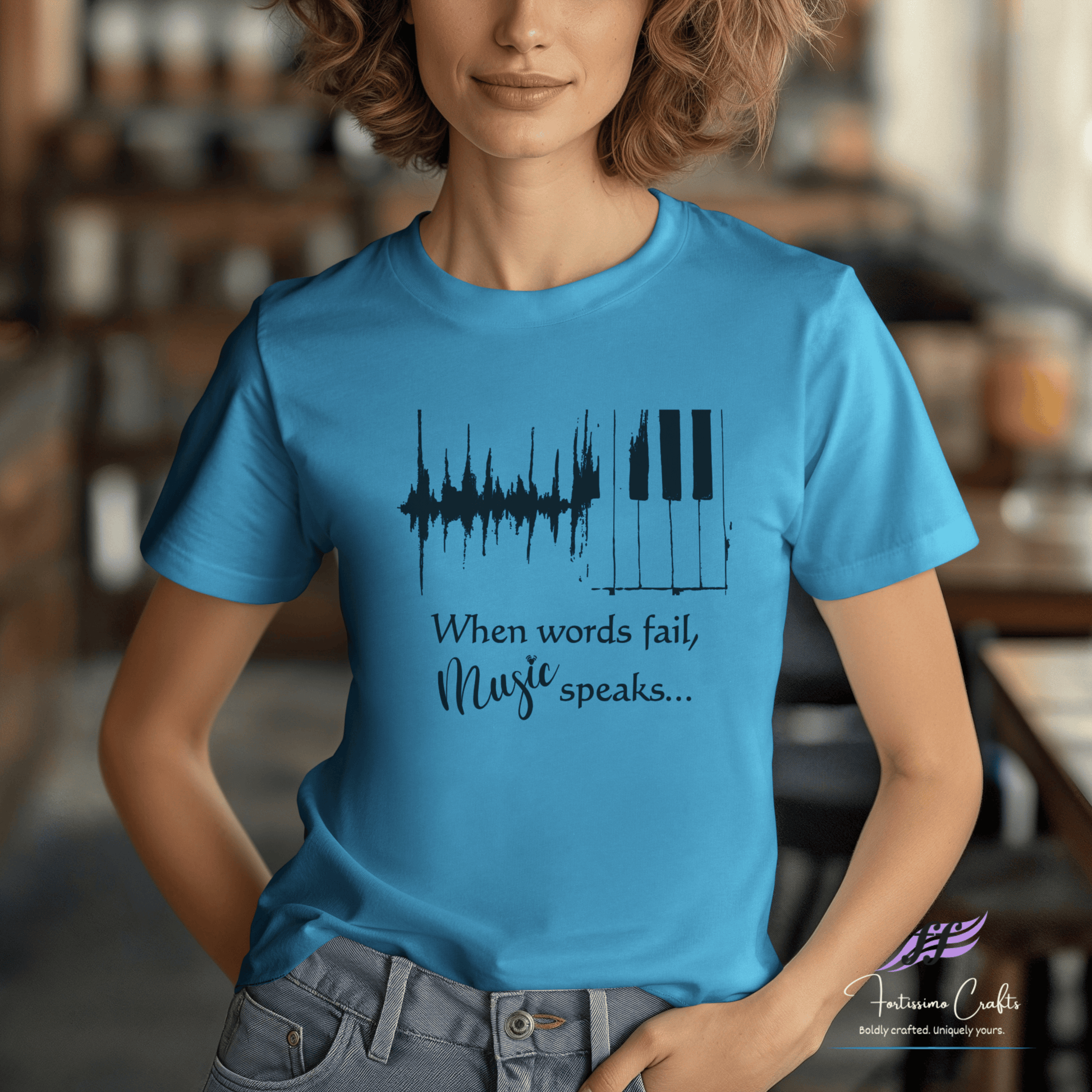 Person wearing a blue t-shirt with a music-themed design and text.