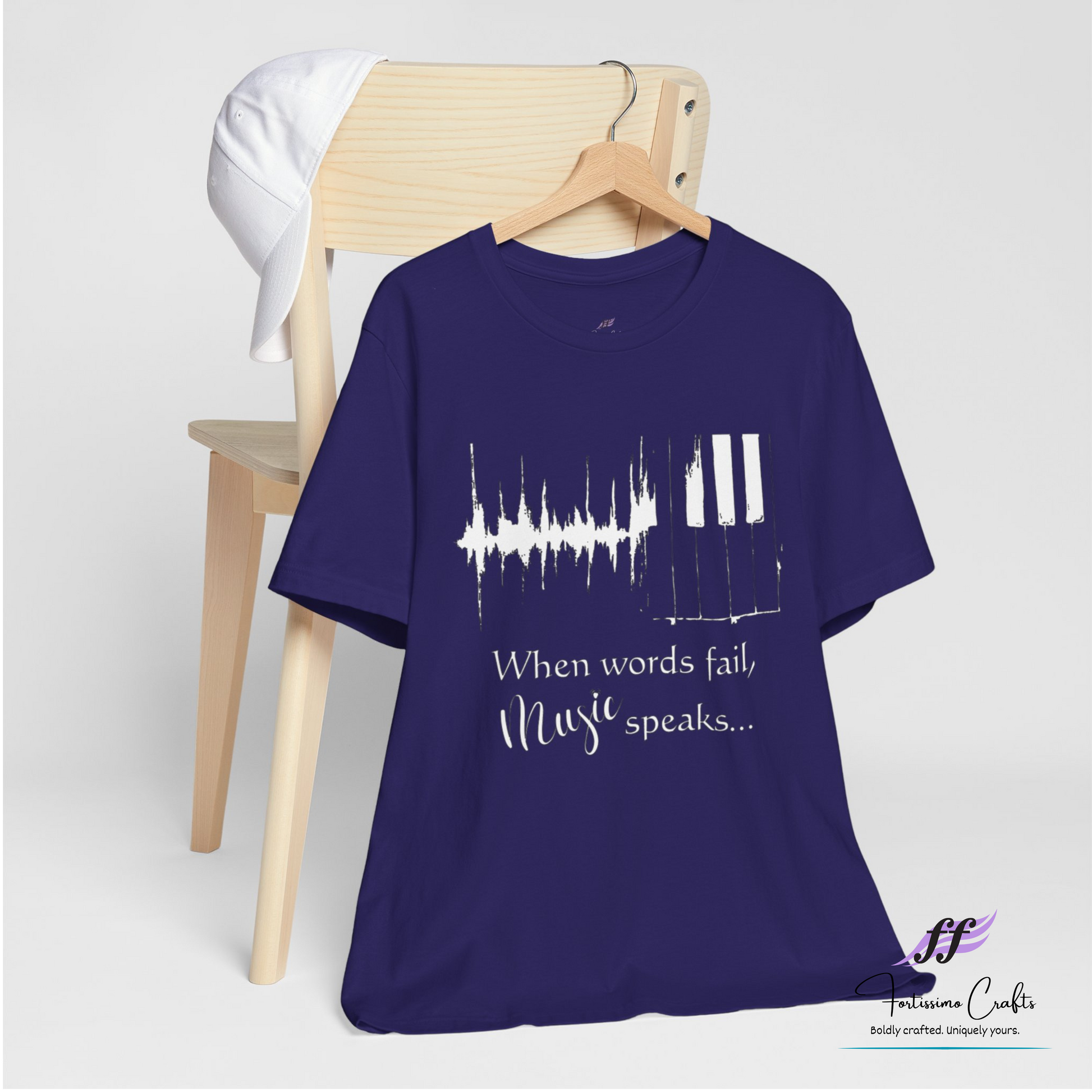 Purple t-shirt with music-themed design and text on a white background