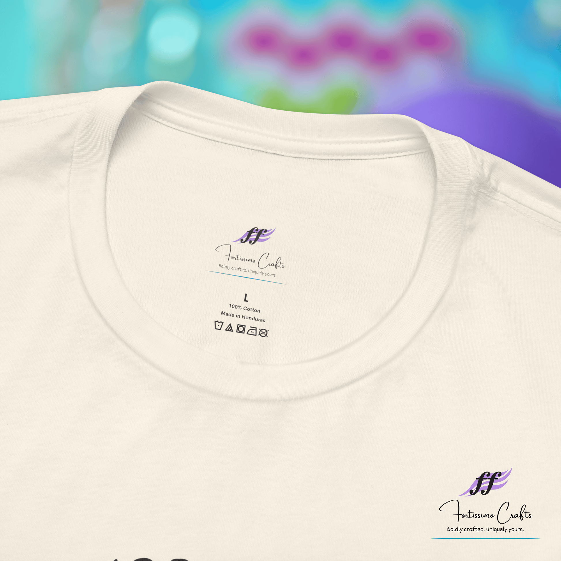 White t-shirt with a brand label on a colorful blurred background