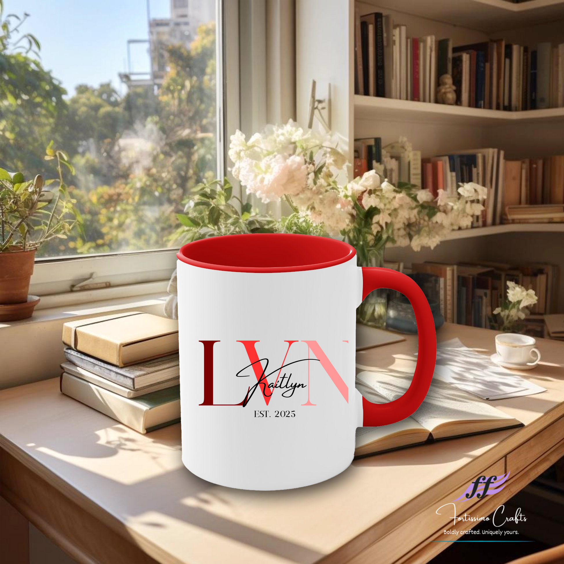 White mug with red interior and handle on a desk with books and flowers