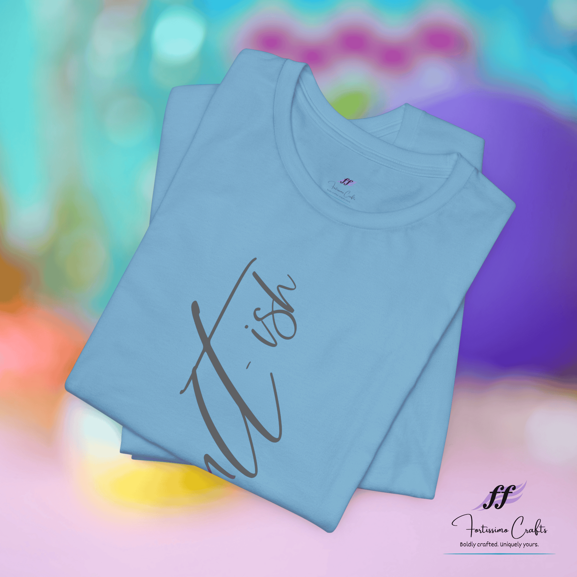 Light blue t-shirt with 'itish' text on a colorful blurred background