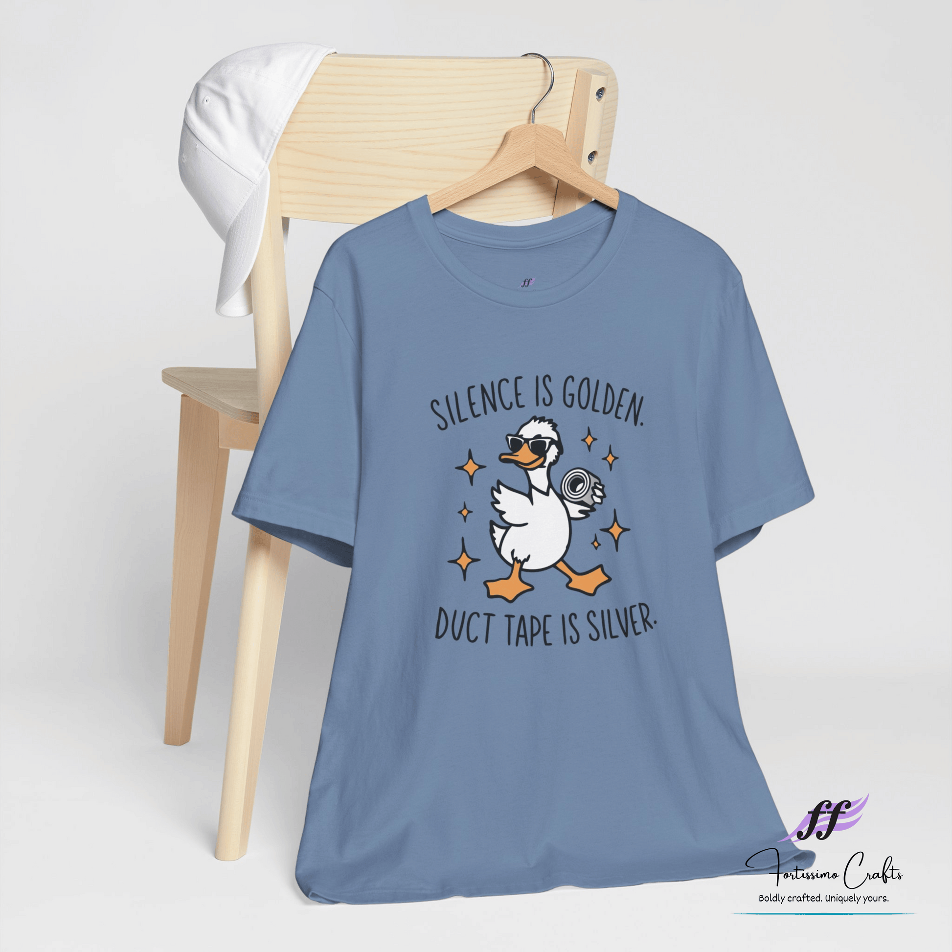 Blue t-shirt with a duck graphic and text on a white background