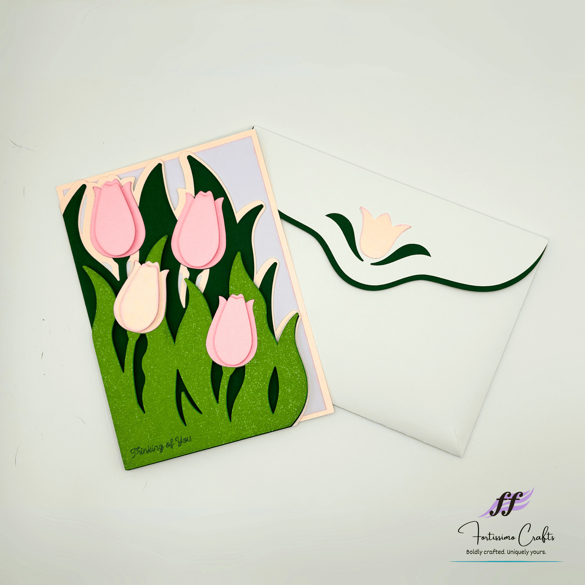 Greeting card with pink tulips design on a white background