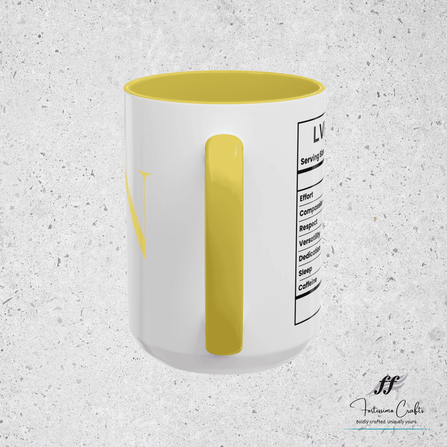White mug with yellow interior and label on a textured gray background