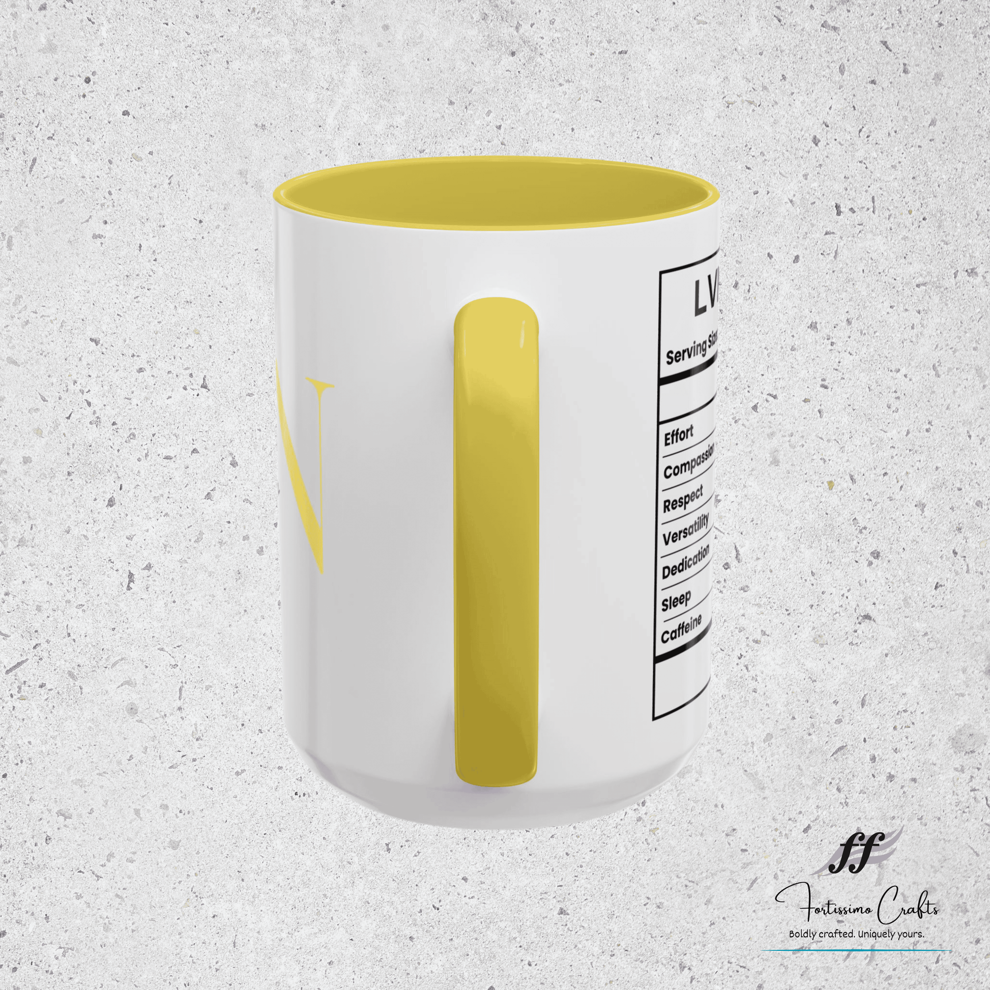 White mug with yellow interior and label on a textured gray background