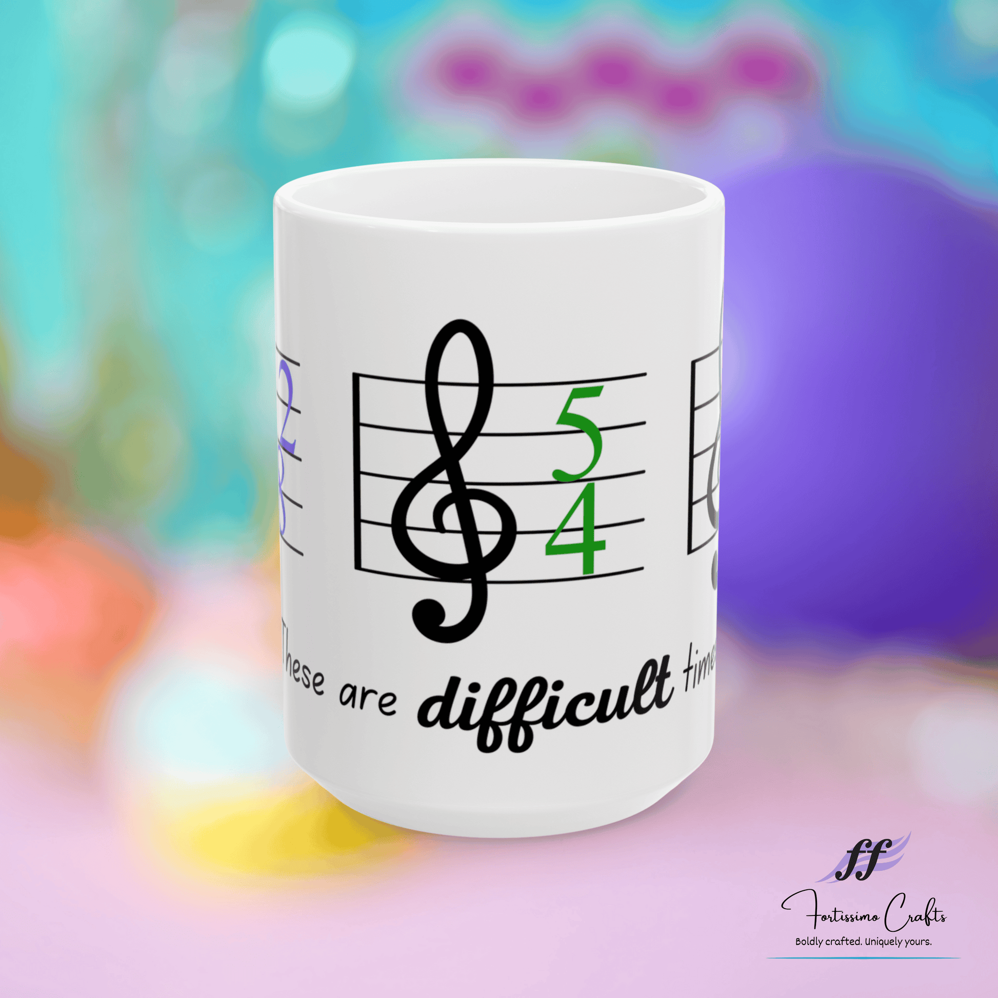 front view of 15oz white ceramic mug with music staff, 5/4 key signature and these are difficult times with a multi-colored background