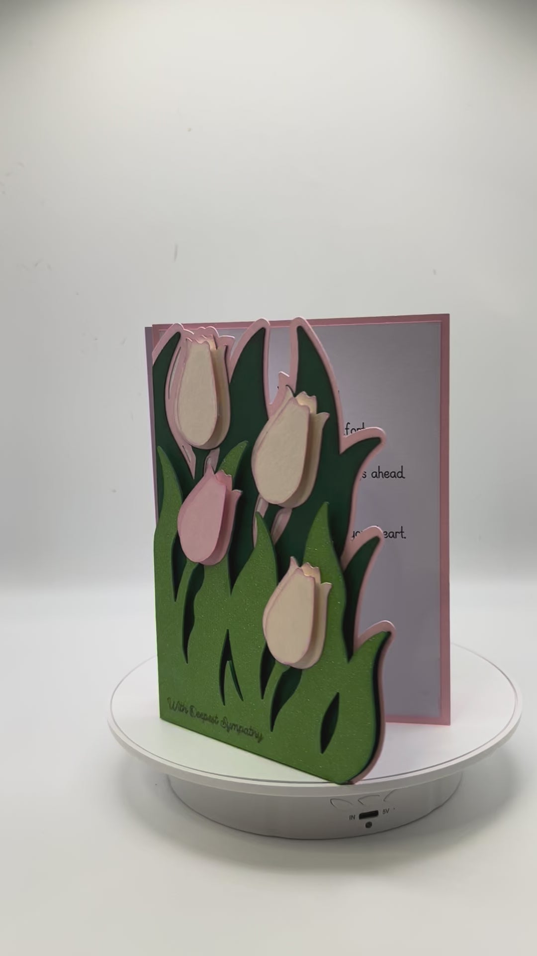 Vide of two cards with tulips in pink and lavendar rotating to show full view