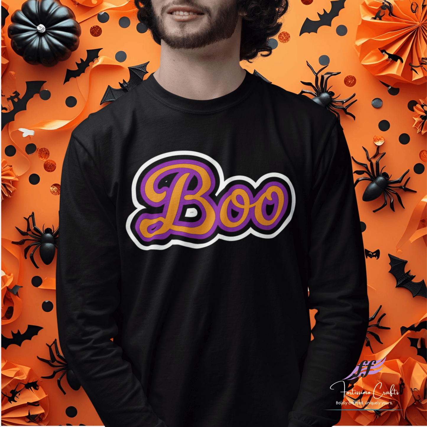 Black long-sleeve shirt worn by a man with 'Boo' design on an orange Halloween-themed background
