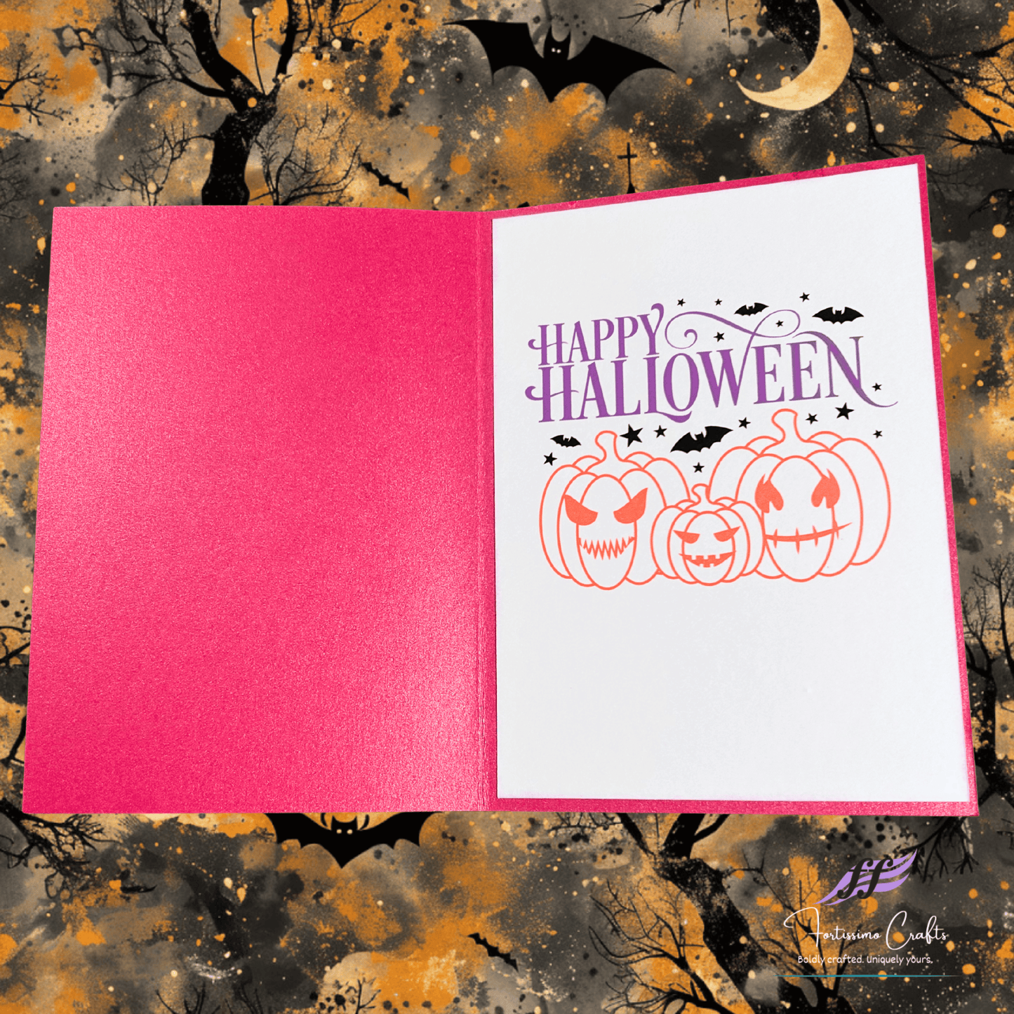 Halloween-themed card with pumpkins and 'Happy Halloween' text on a pink background, set against a spooky background.
