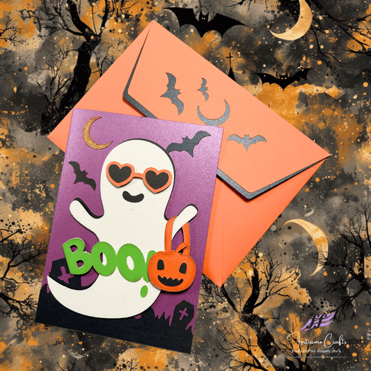 Halloween-themed card with a ghost and pumpkin on a purple background, featuring an orange envelope against a spooky tree and moon backdrop.