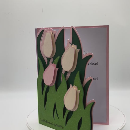 Vide of two cards with tulips in pink and lavendar rotating to show full view